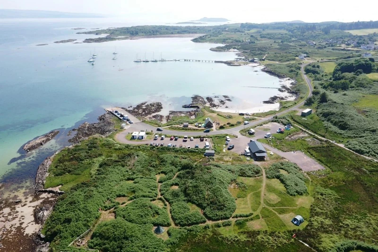 Aerial view of Gigha campsite pitches beside the sea
