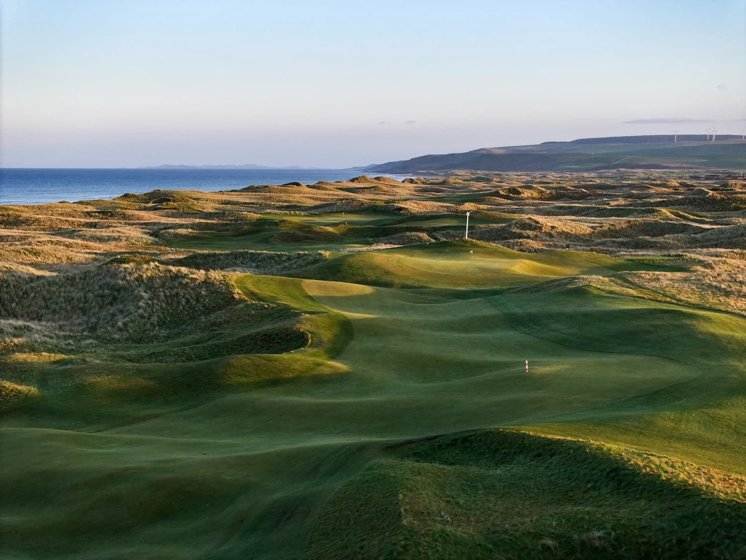 Machrihanish Golf Club links and coastline in low evening light