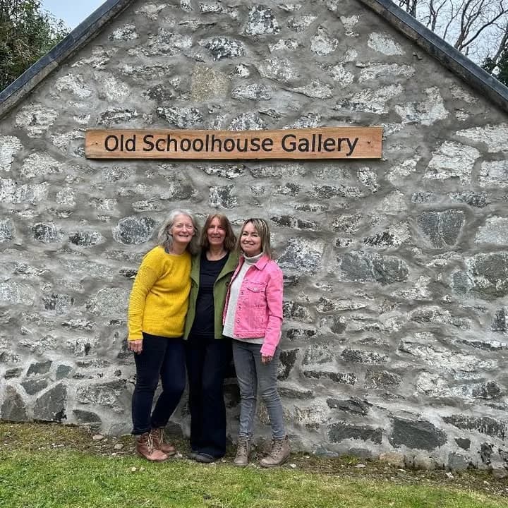 People outside the signed entrance to the Old Schoolhouse Gallery in Carradale
