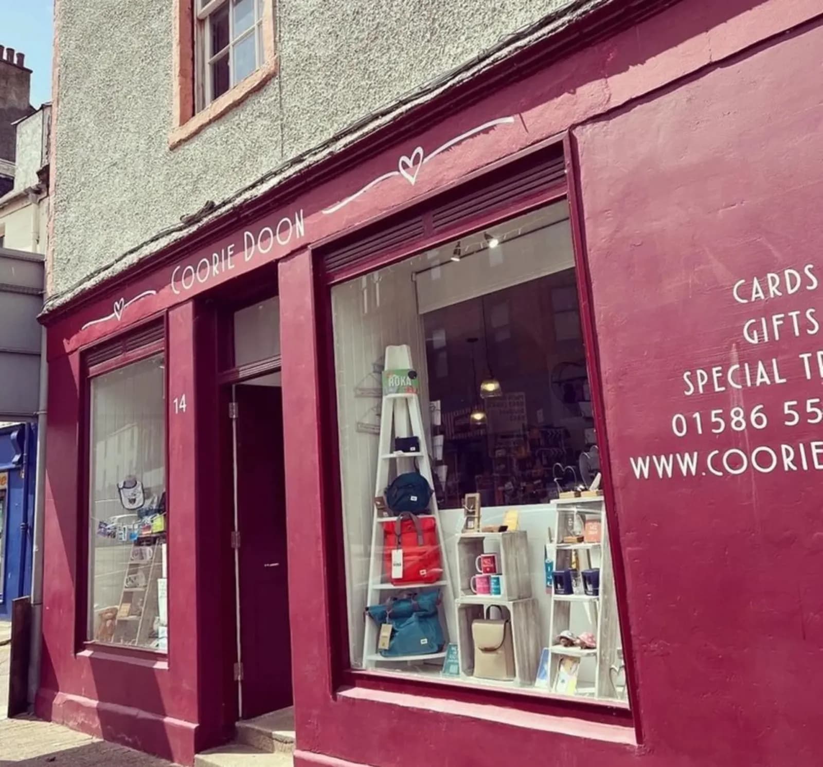Red storefront and gift display at Coorie Doon in Campbeltown