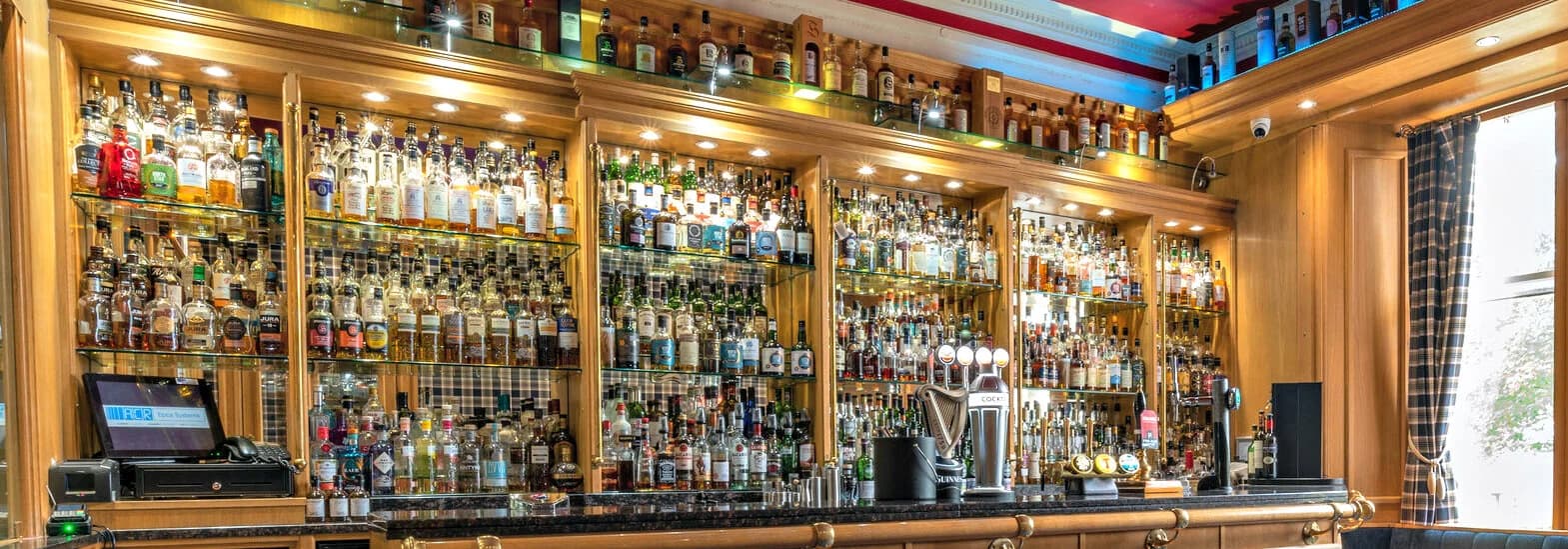 Whisky shelves and seating in the Ardshiel Hotel bar