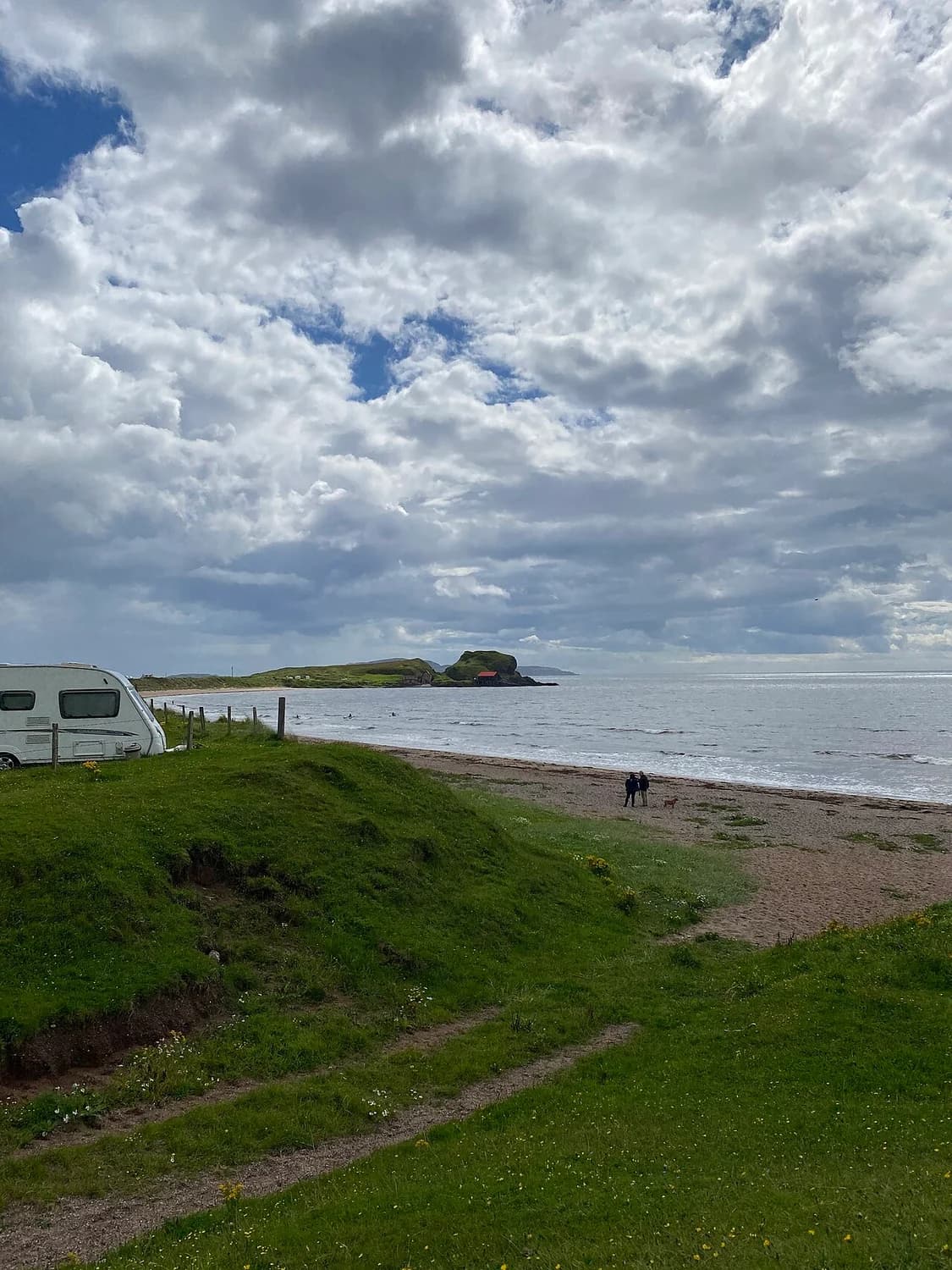 Dunaverty Bay shoreline and grassy coastal path near Southend