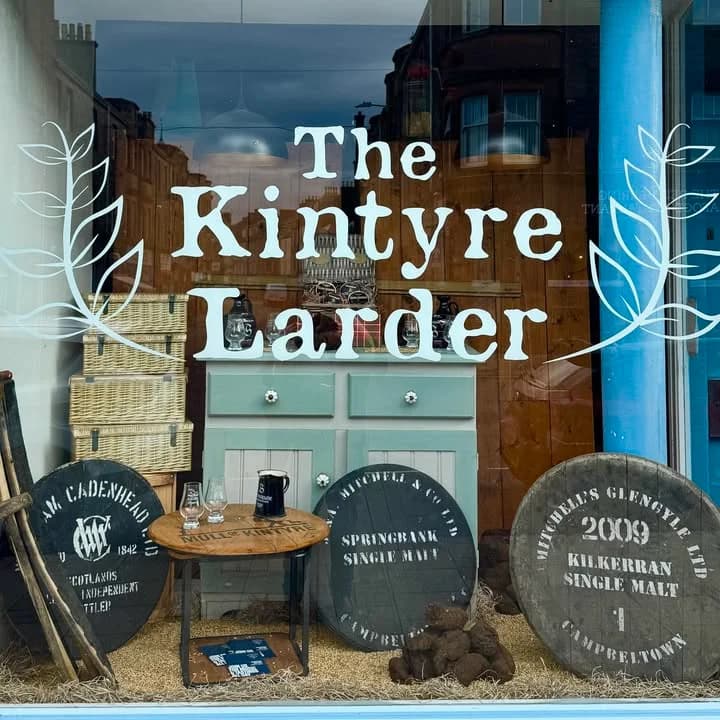 The Kintyre Larder window display with a gift hamper and shop sign